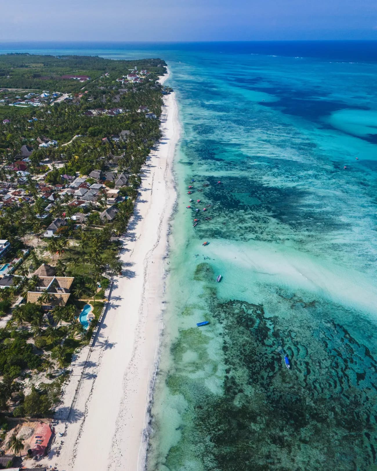 The long white beach and reef flat at Kiwengwa on the east coast of Zanzibar
