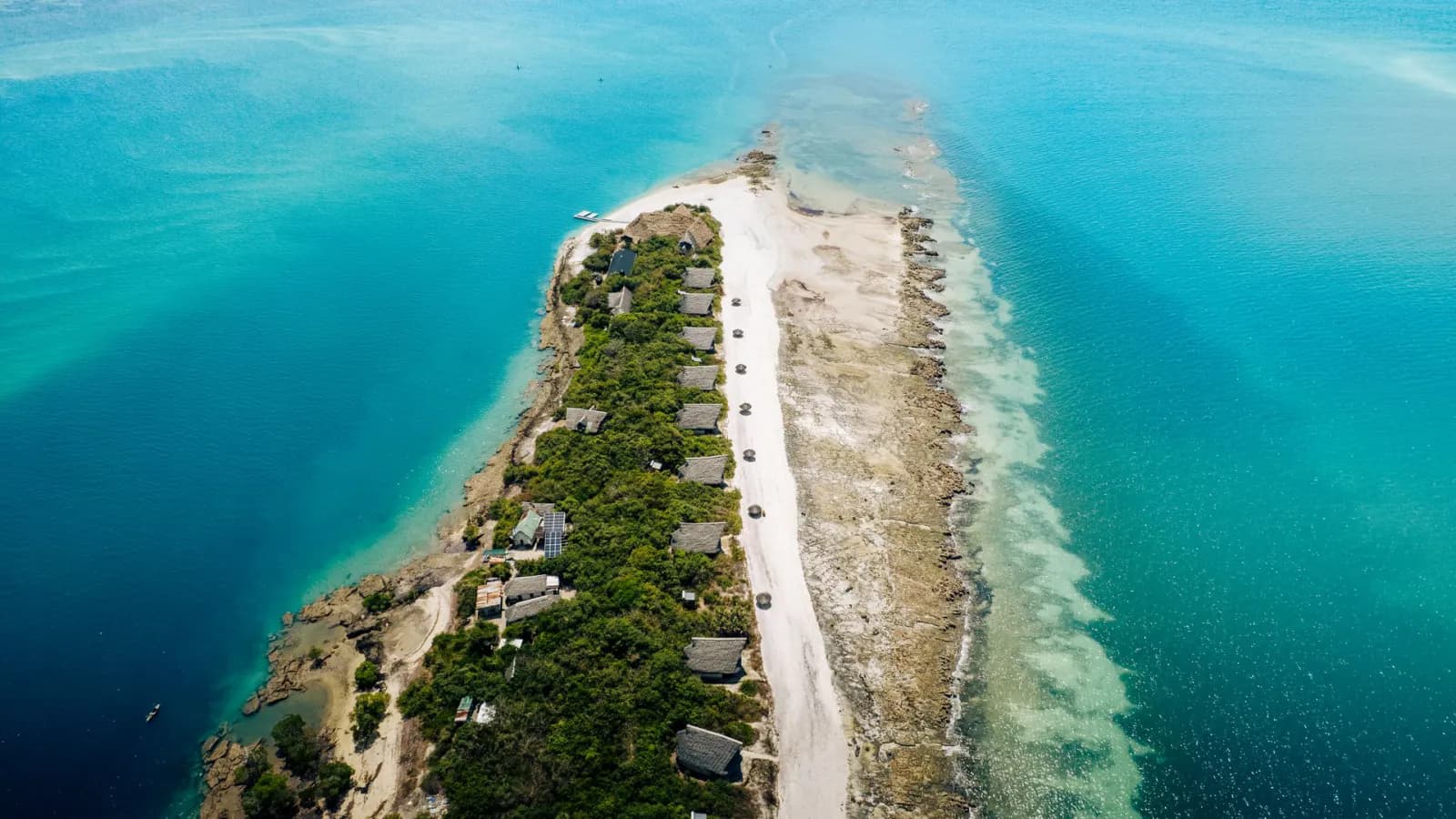 Aerial view of a narrow sandy spit and turquoise lagoon off Pemba Island, Tanzania