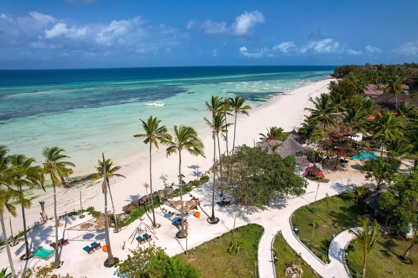 Aerial view of a beach resort and its pool along the Zanzibar coast
