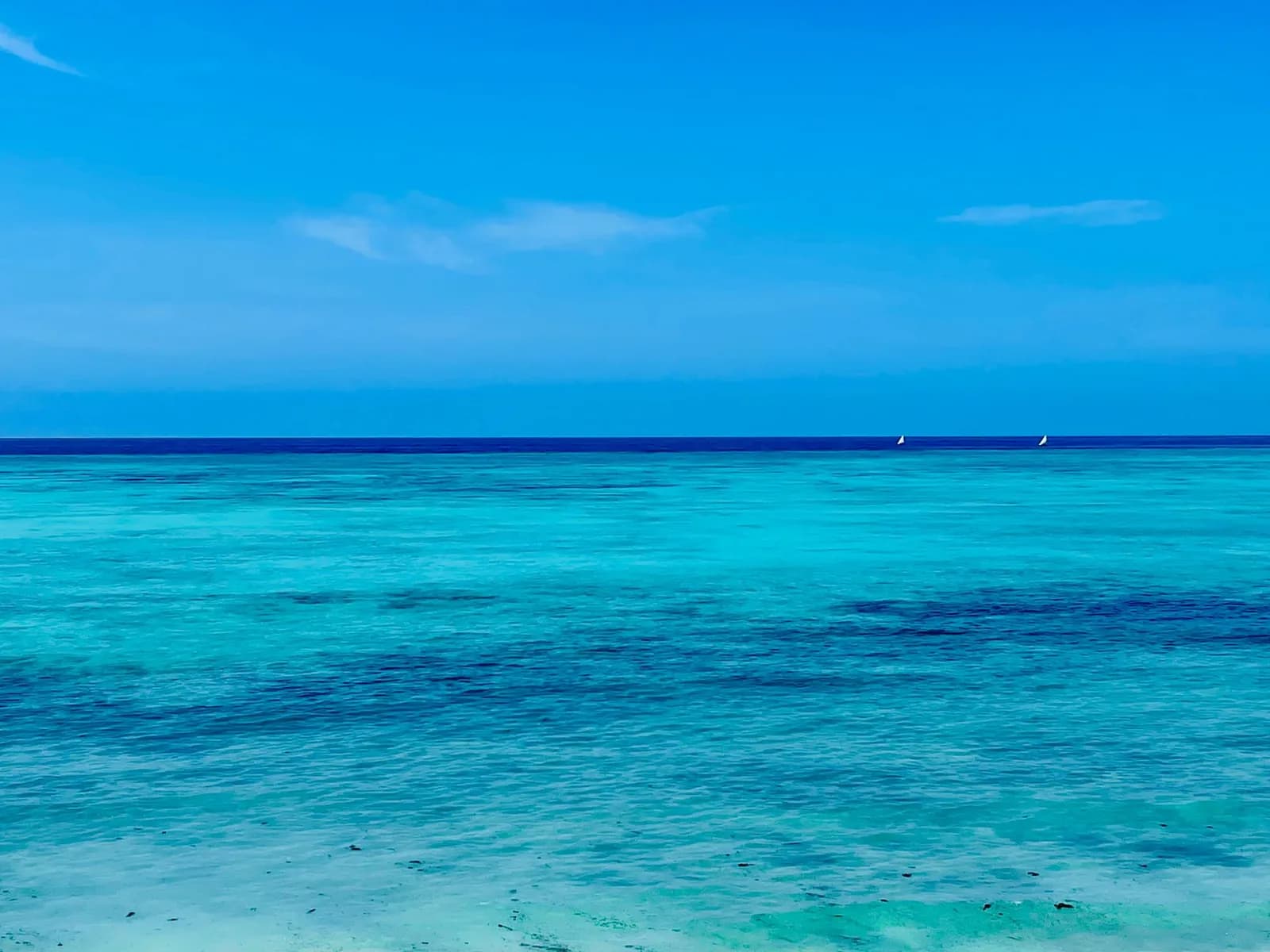 Turquoise lagoon water inside the reef line on the east coast of Zanzibar