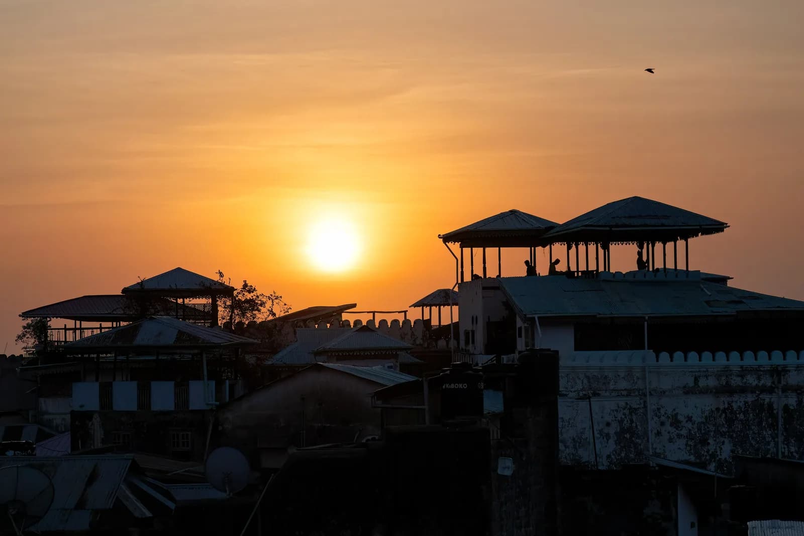 Sunset over the Stone Town rooftops seen from a rooftop restaurant